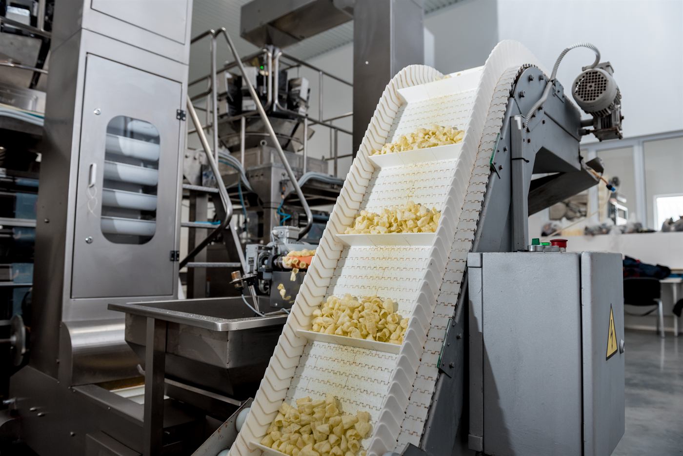 Food production conveyor line in a modern processing plant